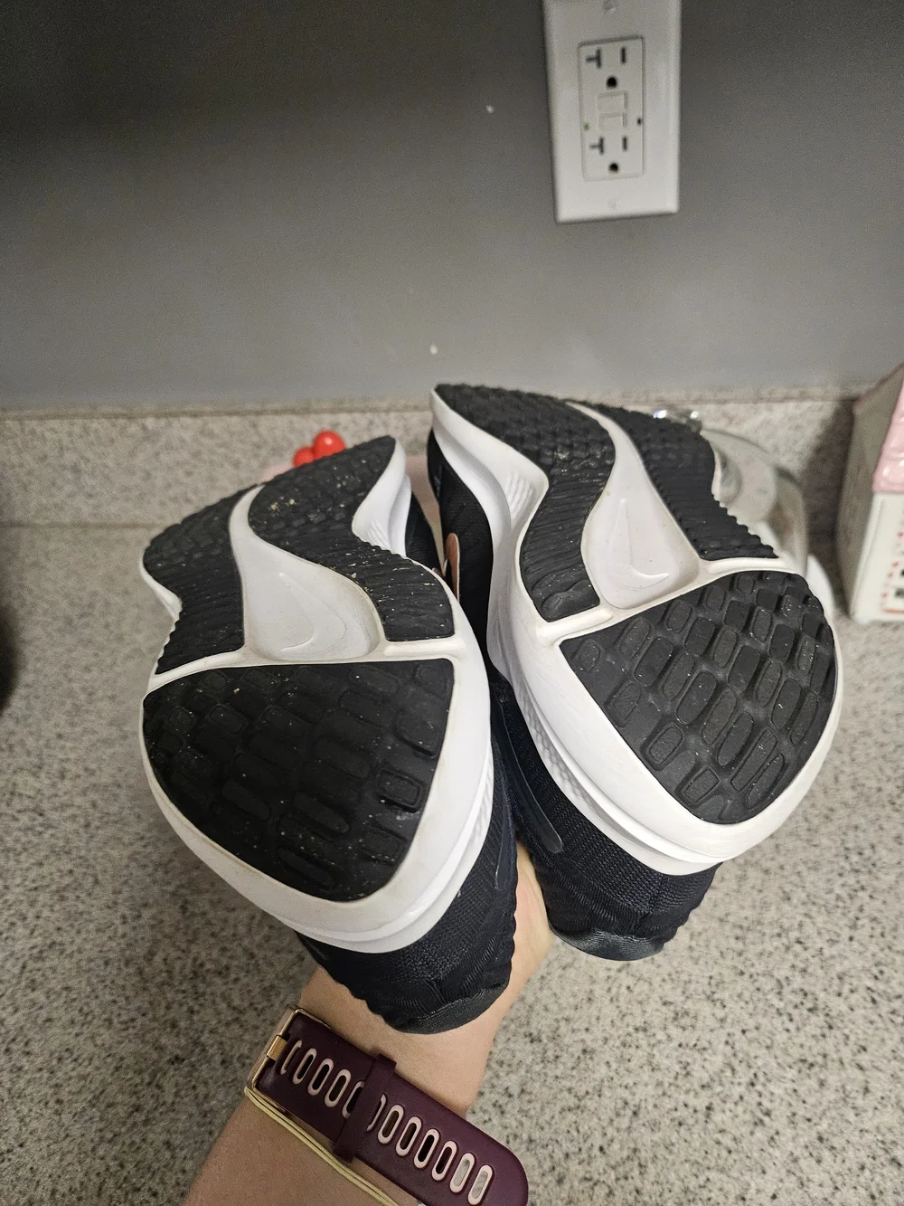 Nike Women's Black Running Shoes with Metallic Orange Swoosh